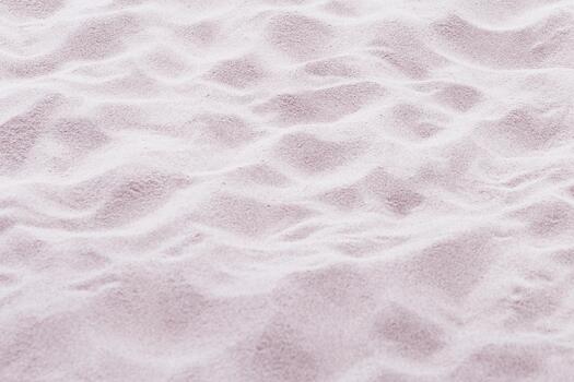 Sand texture natural background. Close up waves pattern on sand dunes, beige pink pastel color, minimal nature backdrop, beautiful beach. Summer and travel, spa concept. Selective focus photo