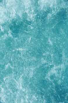 Bubbling water texture, flow thermal water as abstract background macro photo, spa and wellness theme, gentle ripples and gurgling on white turquoise aquatic surface, sea color gradient photo