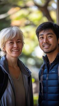 A Couple Smiles Warmly at Each Other, Enjoying a Casual Day Out in Natural Light photo