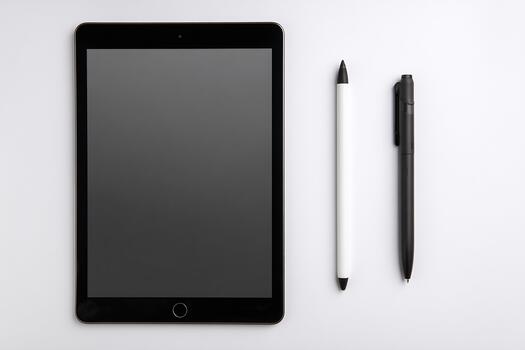 Tablet and stylus on white background with negative space creating a clean minimalist tech workspace scene photo