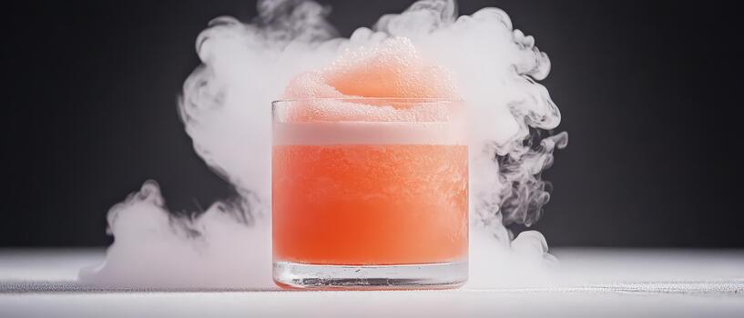 Frothy pink beverage in clear glass with swirling white vapor, evoking advanced culinary techniques and effervescent presentation. photo