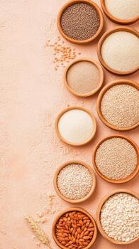Various whole grains and seeds in wooden bowls on textured surface with wheat stalk photo