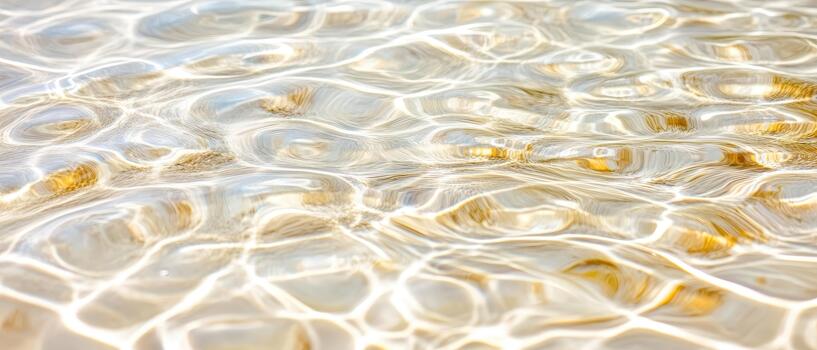 Clear water surface with shifting light patterns and golden sandy bottom, symbolizing natural purity and ecological balance. photo
