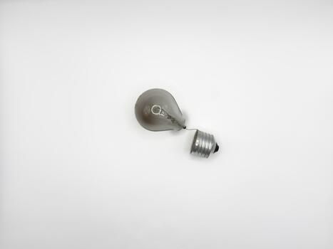 Tungsten light bulb lamp. Non-working light bulb, broken light bulb. Concept of light dar electricity photo