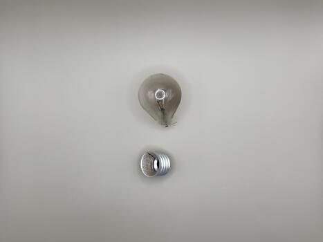 Tungsten light bulb lamp. Non-working light bulb, broken light bulb. Concept of light and dark, idea, electricity save photo