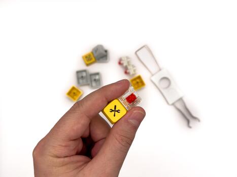 Red switches, Keyboard repair, broken key keyboard, red keycaps, IT, keyboard work, for advertising, white background, copy space photo