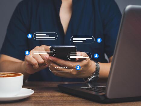 Man typing on a mobile phone with live chat chatting on application communication digital media websites and social networks. photo