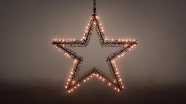 Illuminated five pointed star decoration with warm white lights hanging against a muted background photo