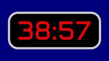 nedräkning timer från 39 minut till 38 minut digital med ljus röd tal på en svart visa och blå bakgrund video