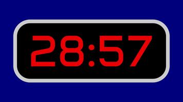Countdown timer from 29 minute to 28 minute digital with bright red numbers on a black display and blue background video