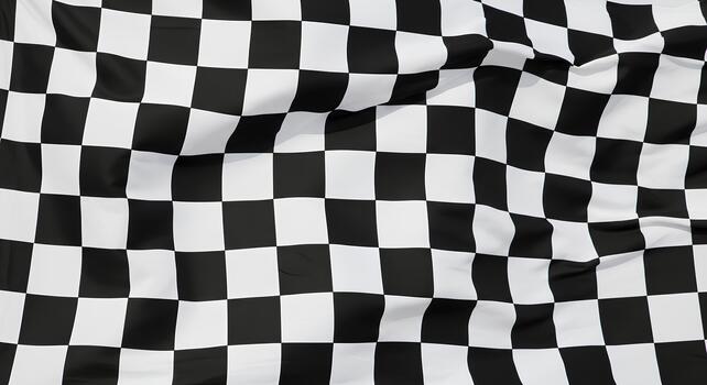 Black and white checkered flag, often associated with auto racing, fills the frame. photo