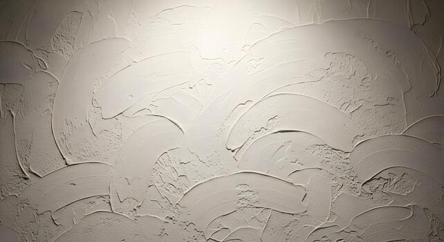 Textured white wall with artistic stucco design and subtle lighting creating depth and dimension photo