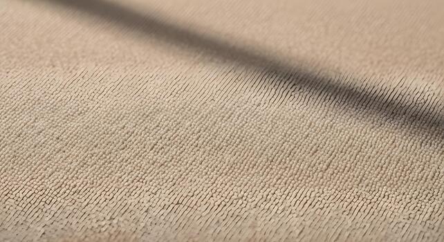 Close-up macro shot of a textured beige fabric surface, showcasing intricate woven patterns and subtle shadow play photo