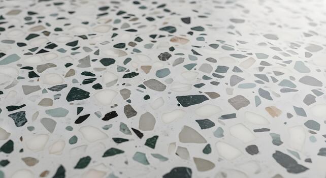 Close-up abstract background of a white terrazzo surface with a mosaic of colorful stone and recycled material chips photo