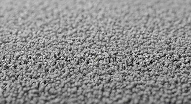 Abstract texture of carpet or rug with soft gray fibers fills the frame and blends in the background photo