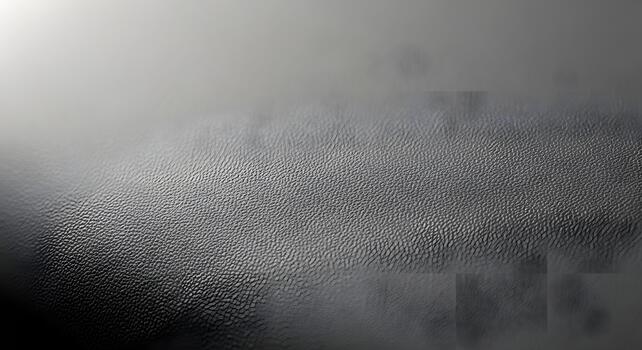 Abstract textured background with a gradient of gray shades, creating depth and dimension photo