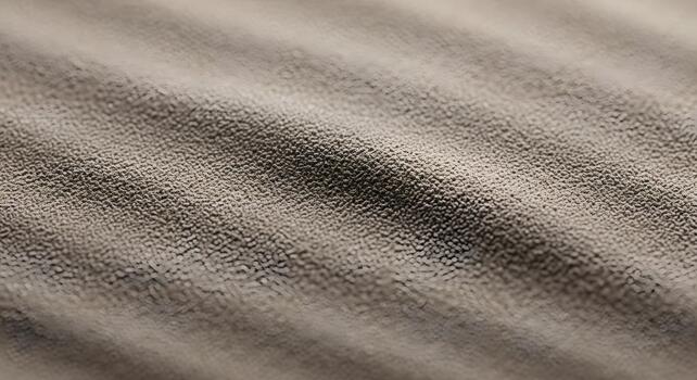 Close-up of a textured surface with a subtle pattern and neutral color palette, tactile texture photo