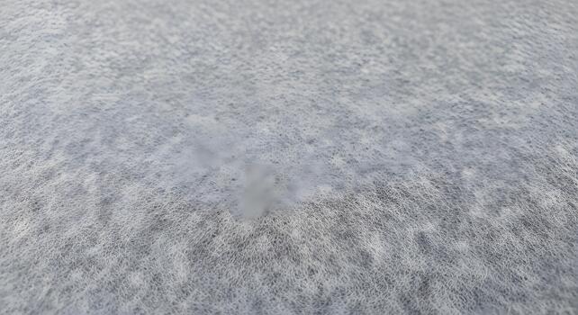 Soft light grey textile texture background with a subtle fibrous pattern, ideal for abstract designs, backdrops, or overlay effects, showcasing delicate surface details photo