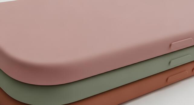 Close-up of three colorful phone cases stacked on top of each other, showcasing texture and design photo