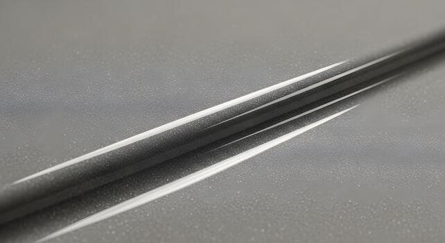 Dynamic abstract pattern featuring sleek, parallel white lines cutting through a subtly textured grey surface, creating a modern and futuristic visual with strong contrast and geometric precision photo