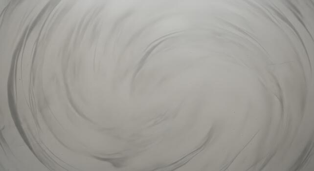 Hypnotic monochromatic vortex of fluid grays, creating a captivating and serene abstract texture perfect for elegant and minimalist design backdrops and overlays photo