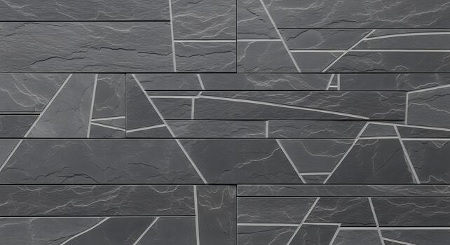 Modern architectural wall cladding featuring dark gray textured stone tiles adorned with intricate abstract geometric patterns in light lines, creating a contemporary and elegant surface design photo