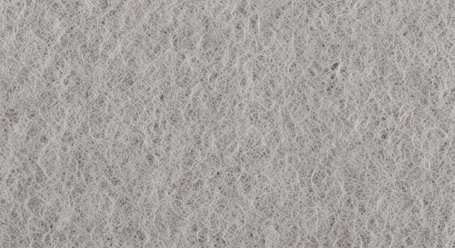 Close-up of a light gray synthetic fiber texture, showing a rough, non-woven pattern. The intricate surface highlights interwoven strands, perfect for abstract backgrounds or material design photo
