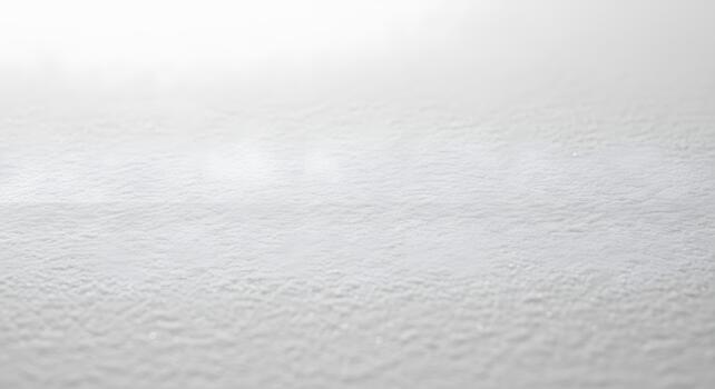 Abstract close-up of pristine white textured surface, resembling freshly fallen snow or delicate ice crystals, creating a serene and minimalist winter background with soft, diffused light photo