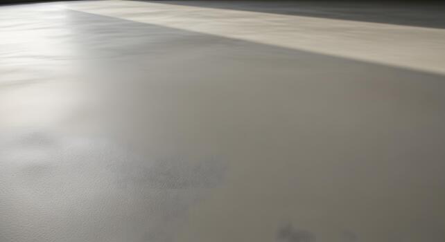 Subtle Texture and Light Play on a Smooth, Neutral Surface, Evoking Calm and Simplicity photo