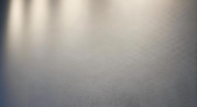 Subtle light gray textured wall background illuminated by soft spotlights, perfect for presentations, product displays, or elegant design backdrops with ample copy space photo