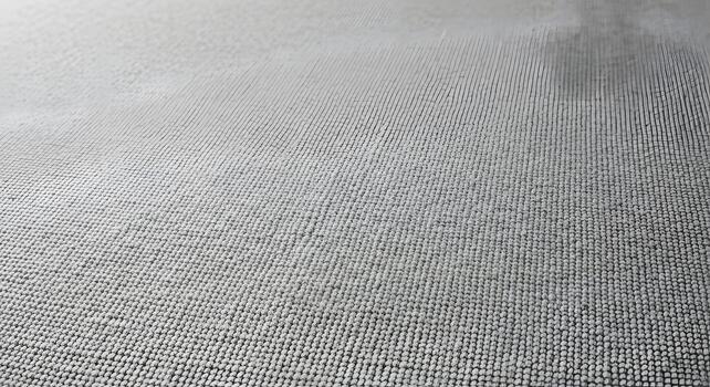 Abstract textured surface with a subtle gradient and fine, linear patterns photo