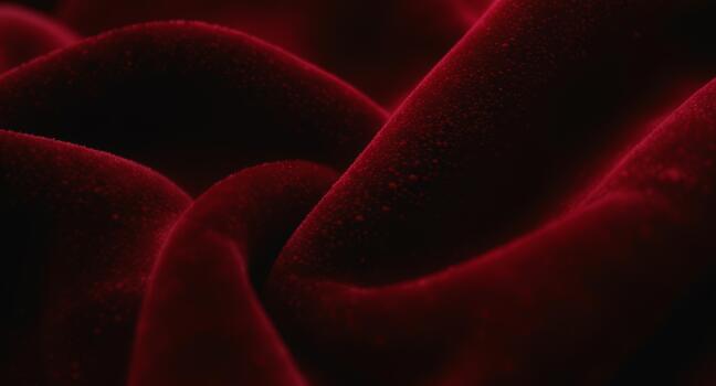 Sensual deep red velvet fabric with a rich, soft texture and elegant draped folds perfect for luxury backgrounds or romantic designs, creating a feeling of warmth. photo