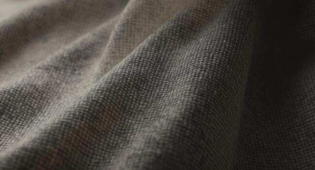 Elegant close-up of textured gray fabric, perfect for backgrounds, fashion design, or textile concepts, evoking comfort and sophistication, ideal for creative projects photo