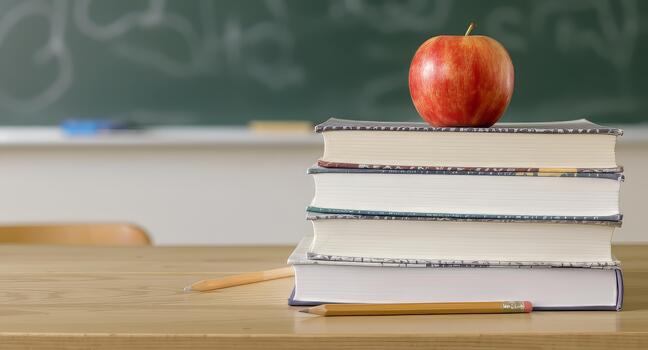 Inspiring classroom scene with apple and books, perfect for education and learning themes, conveying knowledge, growth, and academic achievement in schools photo