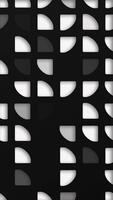 Black and white abstract background with an elegant pattern of quarter circle quadrant cutout shapes. This clean modern vertical design is full HD and a seamless loop. video