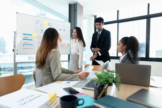 Diverse business people meeting new startup project pointing graph discussion and analysis data charts and graphs.Business finances and accounting concept photo