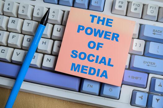 Concept of the power of social media write on sticky notes isolated on keyboard. photo