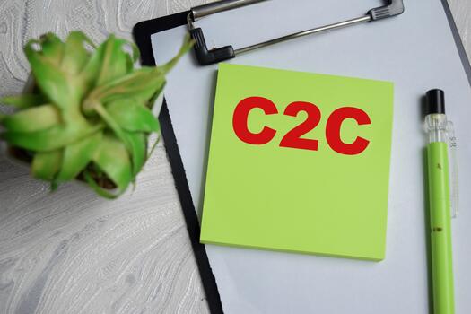 Concept of C2C write on sticky notes isolated on Wooden Table. photo