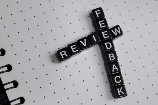 Concept of review and feedback written on wooden blocks. photo