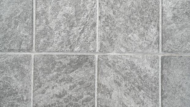 Textured Gray Stone Tiles in Square Patterns Suitable for Modern Interior and Exterior Design Projects, Background and Surface Choices for Home Renovation photo