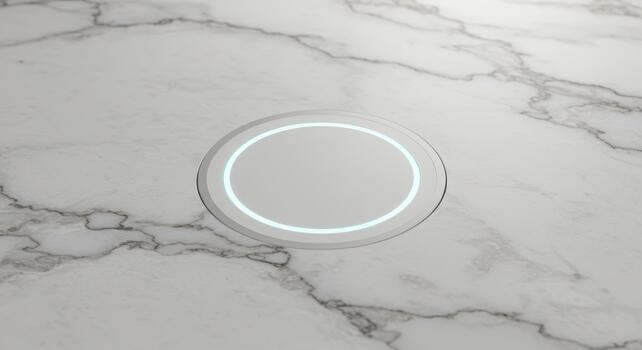 A modern wireless charging pad with a blue glowing is embedded in a sleek white marble surface ready to charge mobile device easily. photo