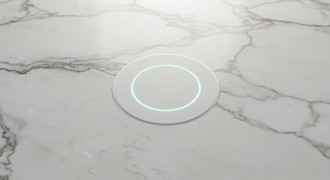 A circular white object with a glowing blue sits centered on a luxurious marble surface creating a clean and modern composition. photo