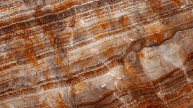 Detailed close up of brown banded onyx texture creates an abstract design with layers of color variation in the rock formation background. photo