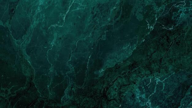 Deep emerald green marble stone surface shows intricate natural veins and patterns creating an elegant textured abstract background material. photo