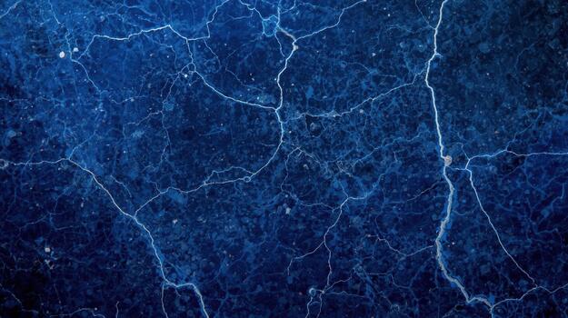Detailed abstract of dark blue marble texture with white cracks resembling lightning strikes, creating a striking and visually captivating surface. photo