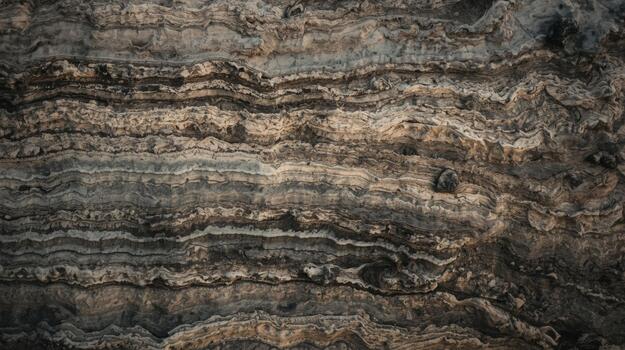An overhead shot reveals captivating natural patterns in the sedimentary rock layers with varied colors and textures found outdoors in nature. photo