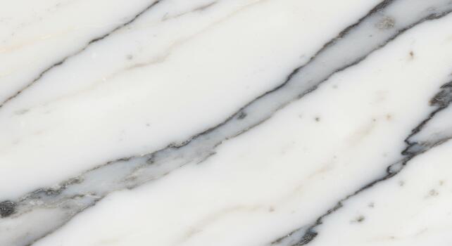 White marble texture displays striking diagonal vein patterns creating an elegant and sophisticated surface for interior design applications. photo