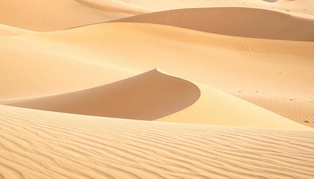 Golden sand dunes stretch across the desert landscape, showcasing nature's patterns and creating a captivating and serene natural scene. photo
