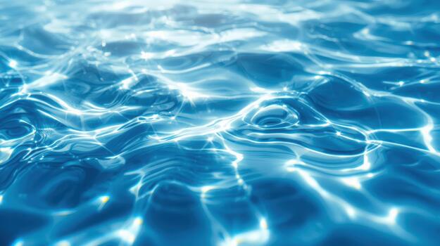 Refraction of sunlight creates shimme and dancing patterns across the serene surface of clear turquoise water on a bright sunny day. photo