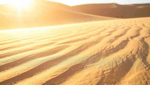 Golden sand dunes ripple gently under the bright sunlight in a vast desert landscape with endless horizon, creating serene atmosphere. photo